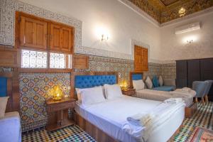 a bedroom with two beds in a room at Riad Iline fes in Fez