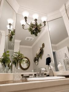 a bathroom with a mirror and a sink at The Elegant & Cozy Retreat in Sammamish +65 photos