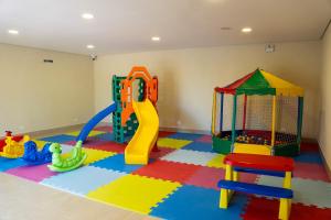 a play room with many different types of play equipment at Beach Hotel Paúba in São Sebastião