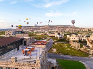 a view of a city with hot air balloons in the sky at Ala Stone Hotel - Balloon View Experience in Göreme