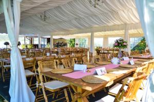 a group of tables and chairs in a tent at Casa Maria in Vrancea