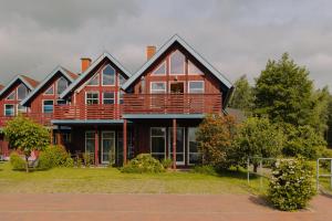 a large house with a deck on top of it at Eldehaus Plau am See klimatisiert in Plau am See