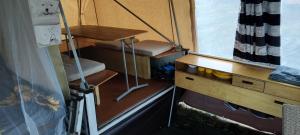 a small room with a desk and a table at DDR Klapfix Camptourist in Sandau