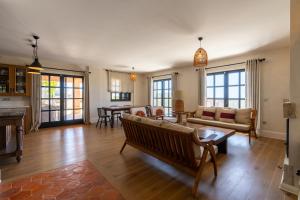 a living room with a couch and a table at Viento Villa in Çeşme