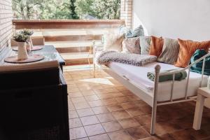 a living room with a couch on a patio at Ferienwohnung Düring in Loxstedt