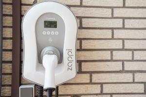 a soap dispenser attached to a brick wall at Ferienwohnung Düring in Loxstedt +24 photos