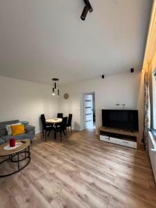 a living room with a couch and a table at NOVA Apartament Podgórze in Wałbrzych