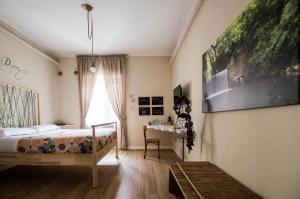 Postel nebo postele na pokoji v ubytování Leucos