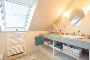 a bathroom with a sink and a mirror at Chambres D'hôtes De Kerantum in Mahalon +43 photos