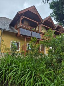 a house with solar panels on top of it at Singer-Hof in Krumpendorf am Wörthersee