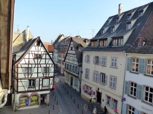 an old street in a medieval town with buildings at La Venise bleue in Colmar