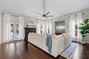 a living room with a couch and a fireplace at The Summer House - Private Pool Firepit in Jacksonville +56 photos