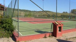 a tennis court with two tennis courts at Bari Sardo Le More Suite 3 in Bari Sardo