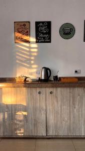 a kitchen with a wooden counter with a kettle on it at Hotel Andino in La Rioja +28 photos