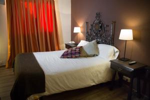 Postel nebo postele na pokoji v ubytování Hotel Venta Magullo