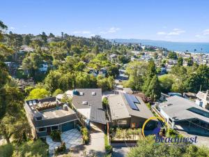 an aerial view of a house and the ocean at Coastal Treehouse in Aptos