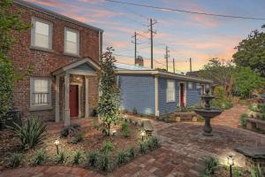 a house with a brick yard with a fountain at Brick house in Savannah