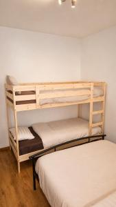 two bunk beds in a room with two beds at Mons 21C in Mons