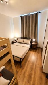 a bedroom with two beds and a window at Mons 21C in Mons +4 photos