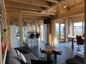 a living room with a couch and a table at Haus Sina in Wangerland