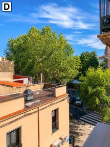 a view of a building with a clock tower at Notre Dame in Perpignan