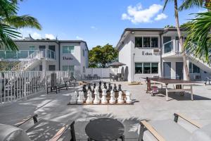 a patio with a chess board and a table at King Suite at Ocean Blvd in Fort Lauderdale