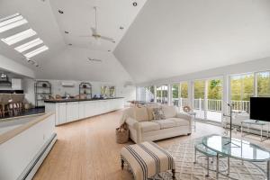 a living room with a couch and a table at Southampton Beauty in Southampton
