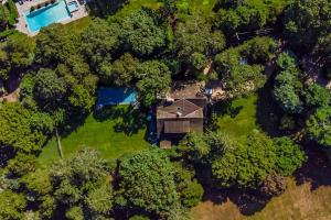 an overhead view of a house in the trees at Cedar Crest Retreat in Southampton