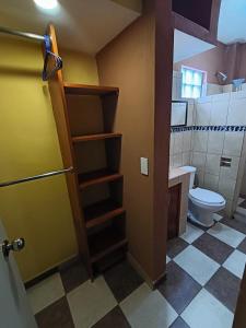 a bathroom with a toilet and a sink at Casa Granada Jilotepec in Jilotepec +138 photos
