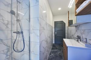 a bathroom with a shower and a sink at Luče Holiday Apartment in Luče