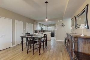 a kitchen and dining room with a table and chairs at Mariner Village 108 in Seabrook