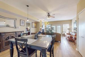 a dining room and living room with a table and chairs at Mariner Village 108 in Seabrook