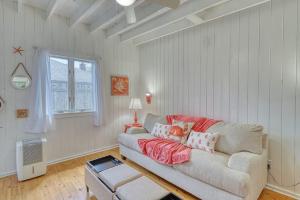 a living room with a couch and a window at The Surfcomber Unit 2 in Ocean Bay Park