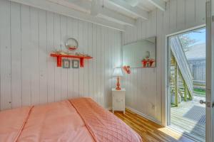 a bedroom with a bed and a large window at The Surfcomber Unit 2 in Ocean Bay Park +9 photos