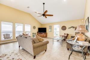 a living room with a couch and a table at Reel Paradise in Bacliff