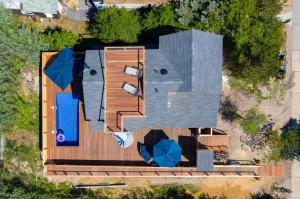 an overhead view of a house with a roof at Poolside Chic by the Sea in Ocean Bay Park