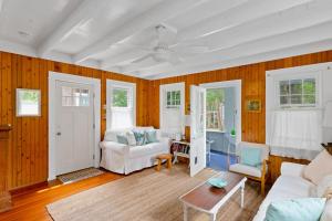 a living room with a couch and a table at Seaclusion Gardens in Ocean Beach