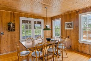 a dining room with a table and chairs at Seaside Escape on Huron in Ocean Beach