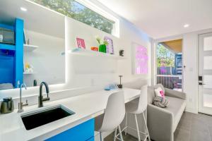 a kitchen with a white counter and a sink at Blueberry Container at EADO Juicebox in Houston