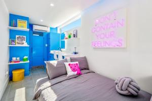 a small bedroom with a bed and a sink at Blueberry Container at EADO Juicebox in Houston