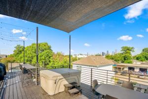 a large deck with a grill on a roof at Blueberry Container at EADO Juicebox in Houston