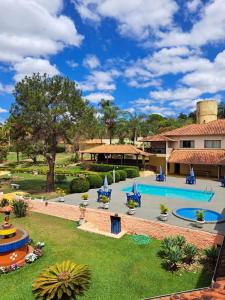 an image of the pool at the resort at Pousada Coqueiro Verde in Mateus Leme