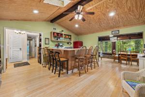 a kitchen and dining room with a table and chairs at Cozy waterfront cabin with fire pit in Old Hickory
