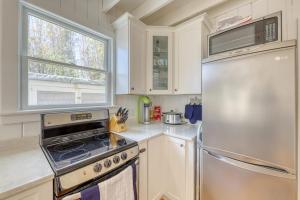 a kitchen with a stove and a refrigerator at The Surfcomber Unit 3 in Ocean Bay Park