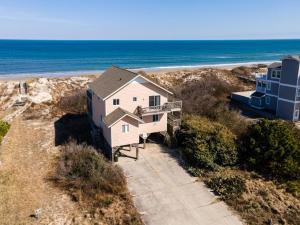 an aerial view of a house on the beach at 1227 - Seven Shells in Corolla