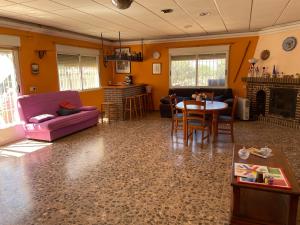 a living room with a purple couch and a table at Mi Cielo in Cartagena