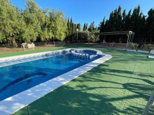 a swimming pool in the middle of a tennis court at Mi Cielo in Cartagena +9 photos