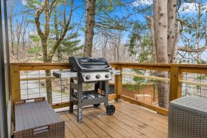 a grill on the deck of a house at Round House in Beech Mountain +18 photos