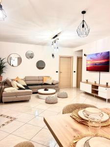 a living room with a couch and a table at Zen Suite in Umag