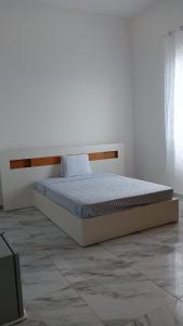 a bed in a white room with a mattress at Riba Mar in Cidade Velha +36 photos